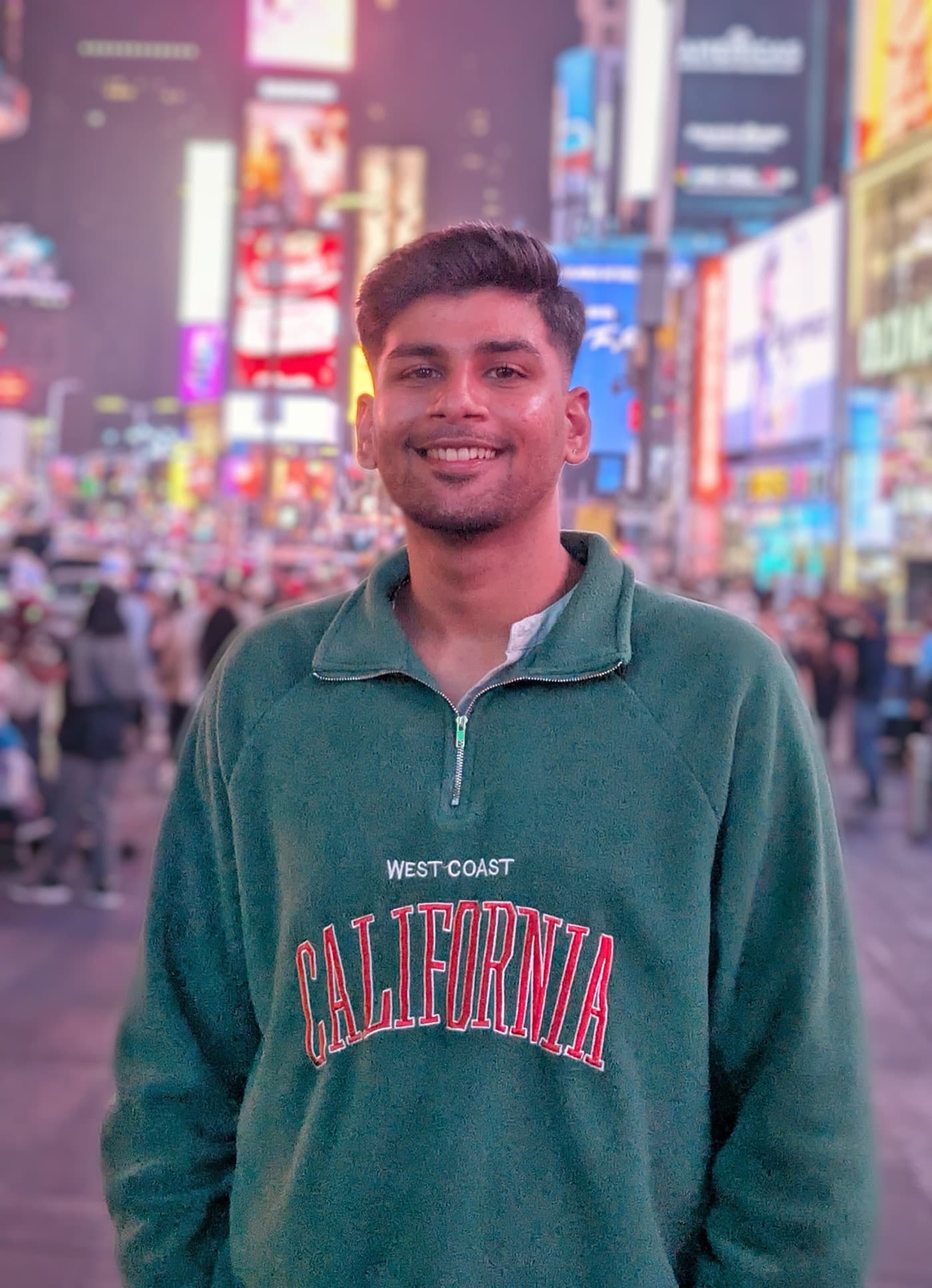 Pranav Patel standing in Times Square, New York
